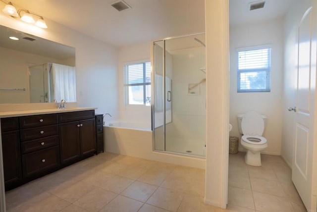 full bathroom with a healthy amount of sunlight, tile patterned floors, and toilet