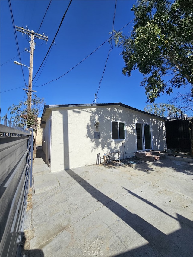 back of house with a patio area