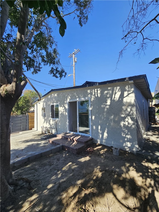 back of property featuring a patio area