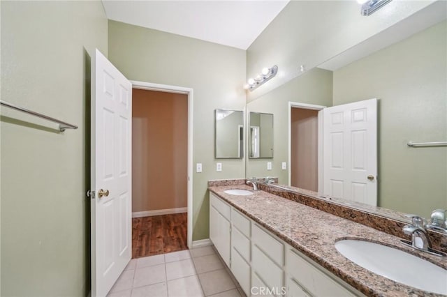 bathroom featuring tile patterned flooring and vanity