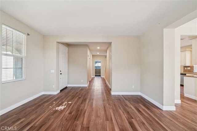 unfurnished room with dark hardwood / wood-style floors