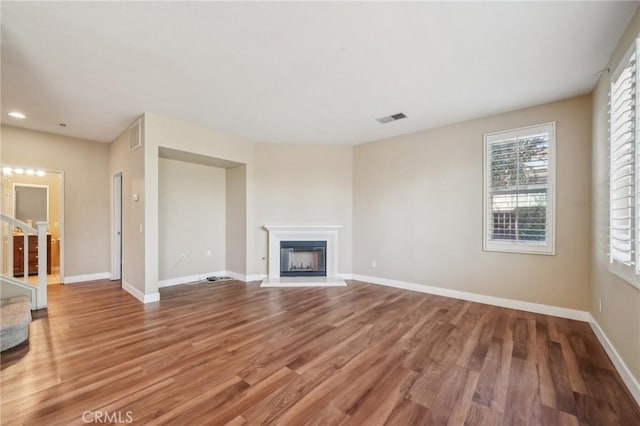 unfurnished living room featuring hardwood / wood-style floors