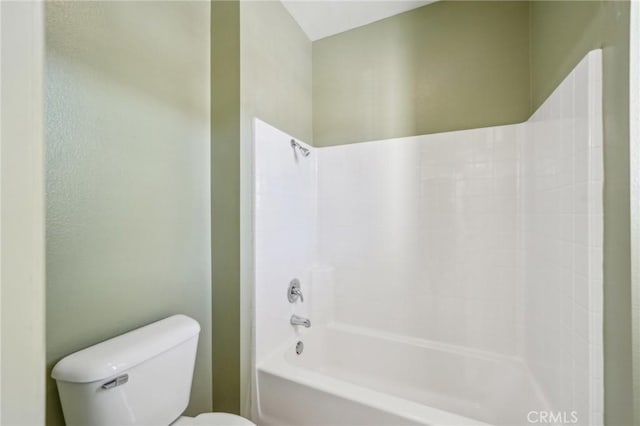 bathroom featuring toilet and shower / bathtub combination