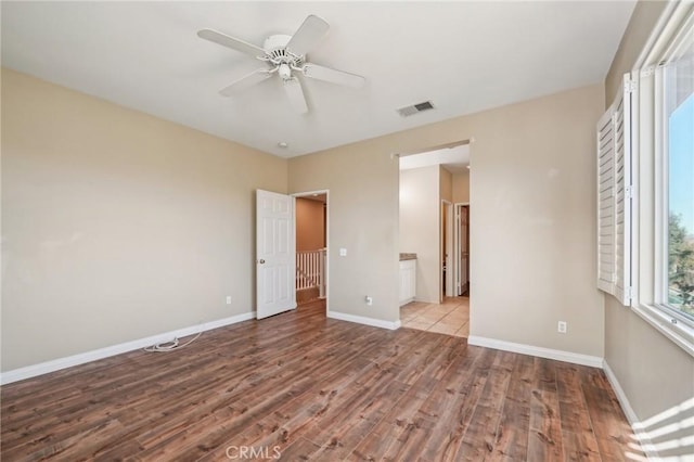 empty room featuring light hardwood / wood-style flooring and ceiling fan