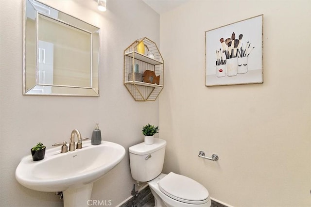 bathroom with sink and toilet