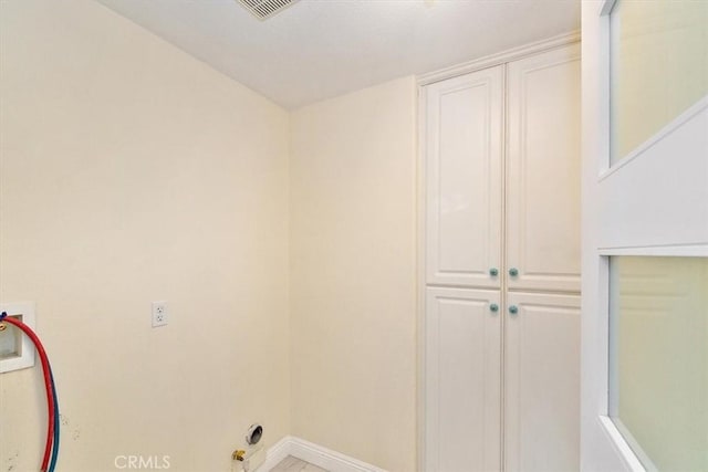 laundry room with cabinets