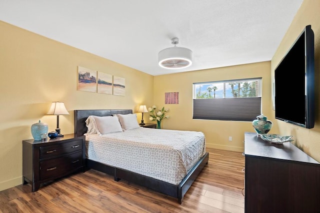 bedroom with hardwood / wood-style floors