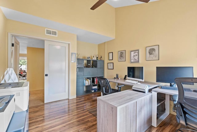 office featuring ceiling fan, dark hardwood / wood-style flooring, and french doors