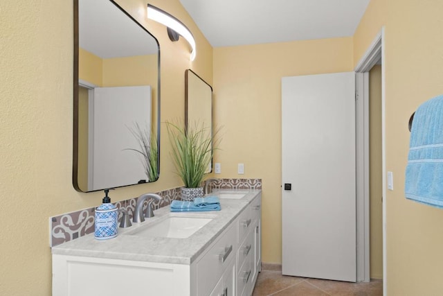 bathroom featuring tile patterned flooring and vanity