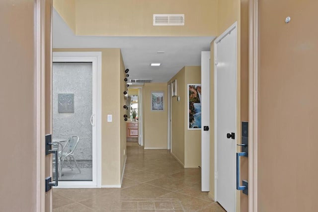 corridor with light tile patterned flooring