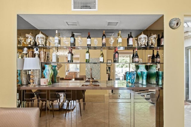 bar featuring tile patterned flooring