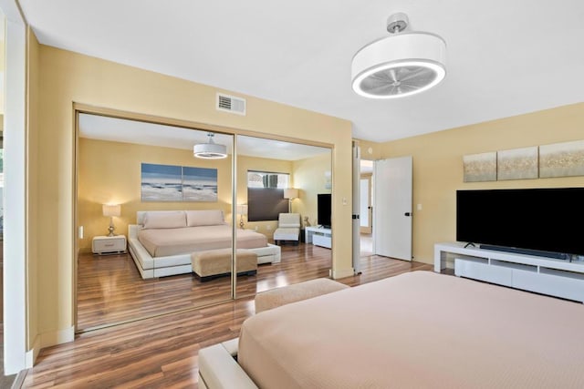 bedroom featuring a closet and hardwood / wood-style flooring