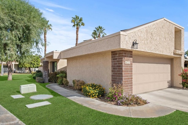 view of property exterior with a garage and a lawn