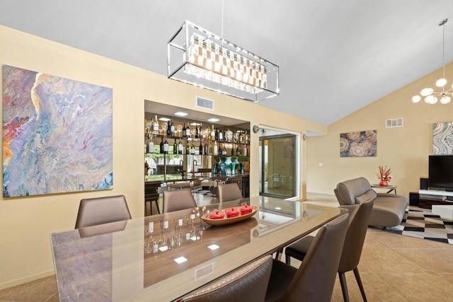 dining area featuring an inviting chandelier, high vaulted ceiling, and light tile patterned floors