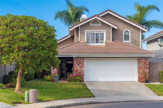 view of front of house featuring a front yard and a garage