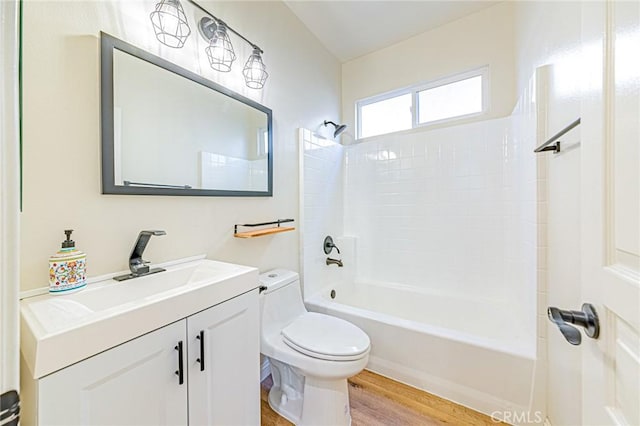 full bathroom with shower / bathtub combination, toilet, vanity, and hardwood / wood-style flooring