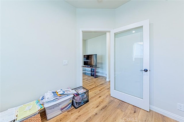 corridor featuring hardwood / wood-style flooring