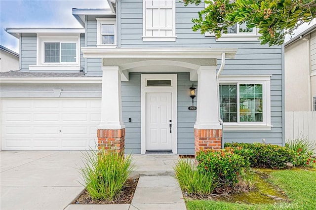 doorway to property with a garage