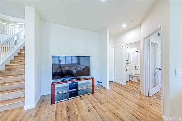 living room with light hardwood / wood-style flooring