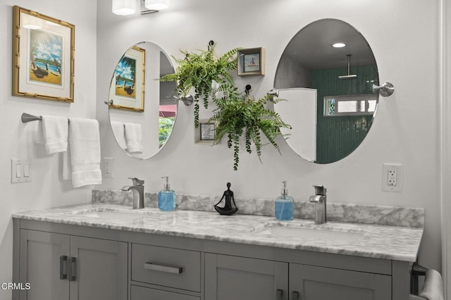 bathroom featuring a wealth of natural light and vanity