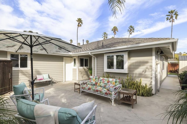 rear view of property featuring an outdoor hangout area and a patio