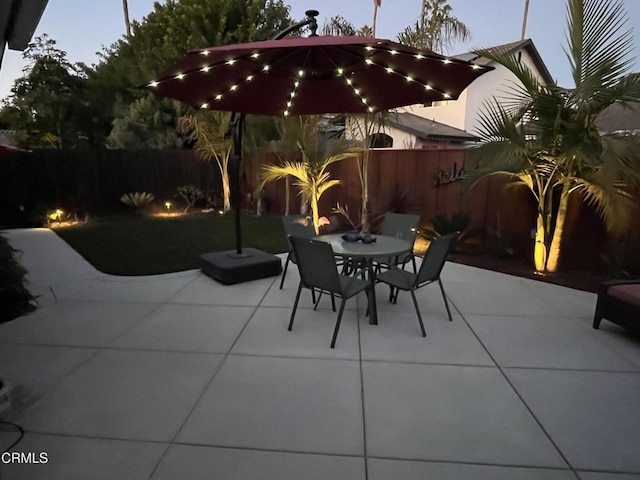 view of patio terrace at dusk