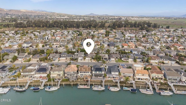 aerial view featuring a water and mountain view