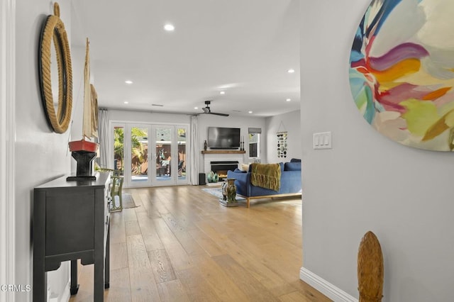 corridor featuring light hardwood / wood-style flooring and french doors