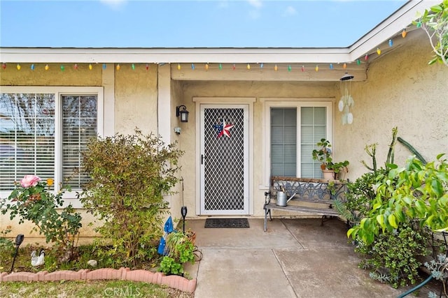 property entrance with a patio