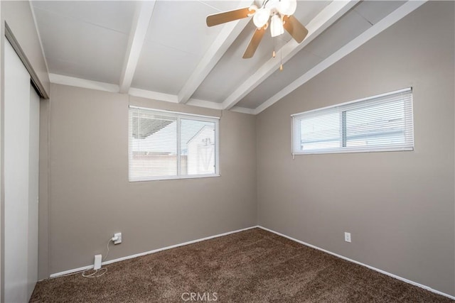 spare room featuring vaulted ceiling with beams, ceiling fan, and carpet