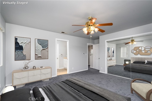 bedroom featuring ceiling fan, ensuite bathroom, a closet, and carpet floors