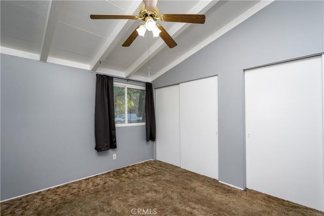 unfurnished bedroom with carpet floors, ceiling fan, and vaulted ceiling with beams