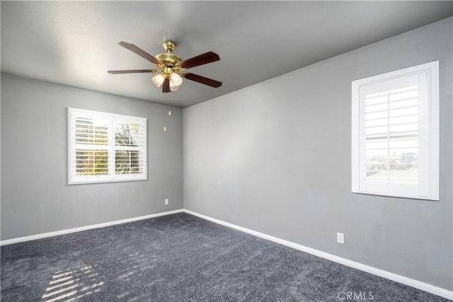 spare room with carpet floors and ceiling fan