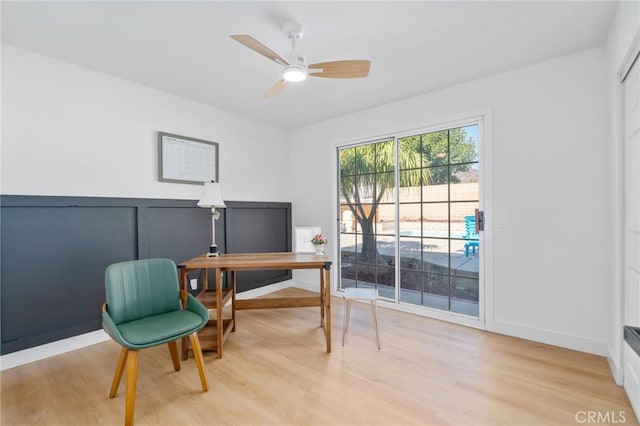 office space with ceiling fan and light hardwood / wood-style flooring