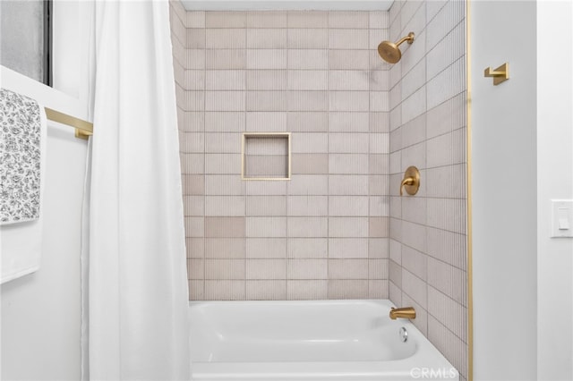 bathroom featuring shower / bathtub combination with curtain