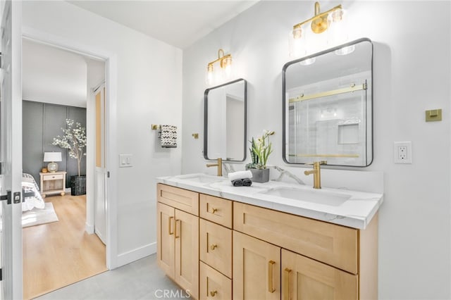 bathroom with wood-type flooring and vanity