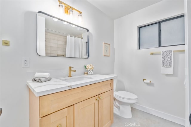 bathroom featuring toilet, a shower with shower curtain, vanity, and tile patterned floors