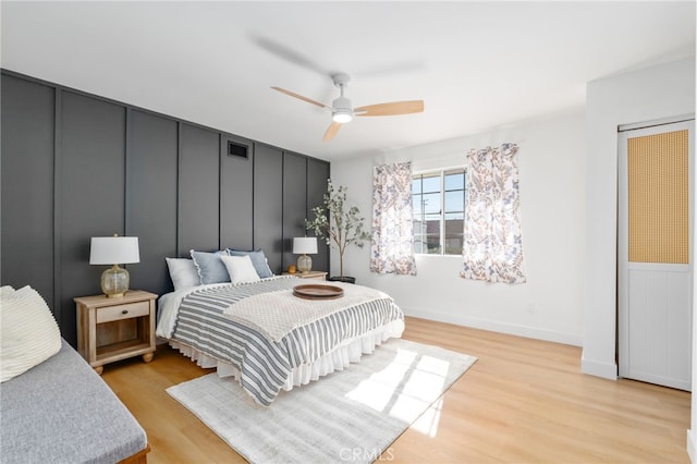 bedroom with ceiling fan and light hardwood / wood-style flooring