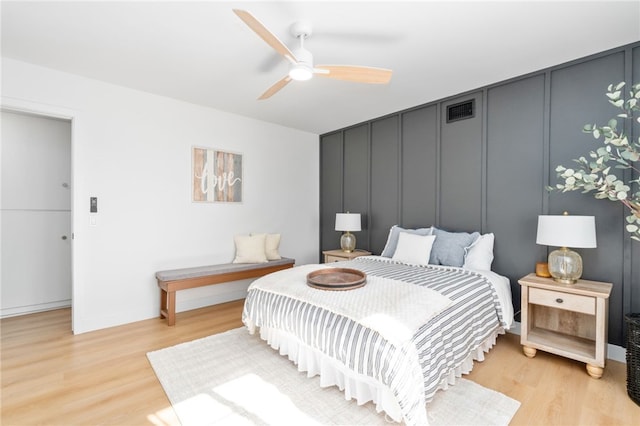 bedroom with ceiling fan and light wood-type flooring