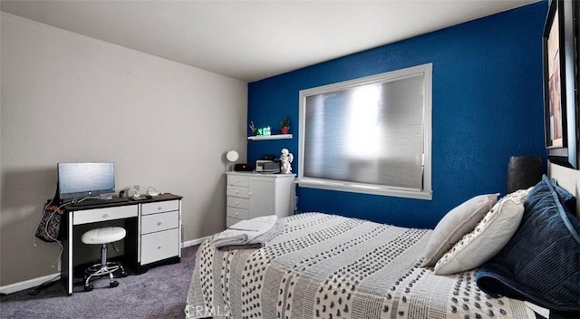 bedroom with dark carpet