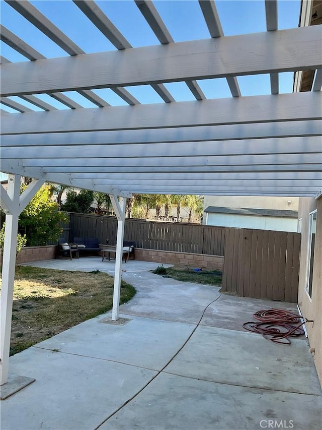 view of patio featuring a pergola