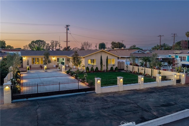 ranch-style home with a yard