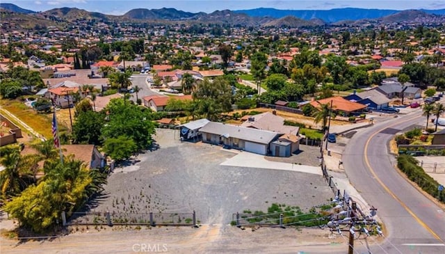 birds eye view of property with a mountain view