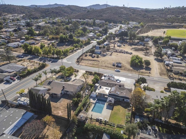 birds eye view of property featuring a mountain view