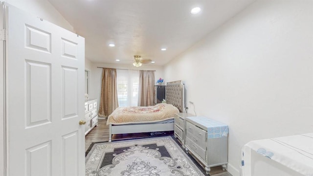 bedroom featuring wood finished floors and recessed lighting