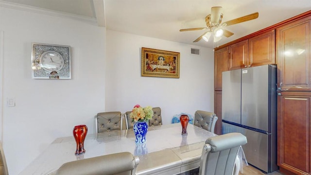 dining space with visible vents and ceiling fan