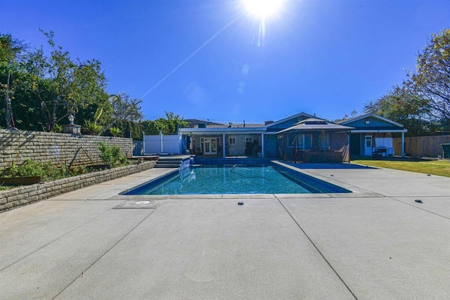 view of pool with a fenced in pool, a fenced backyard, and a patio