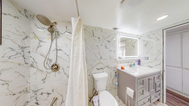 full bath with curtained shower, toilet, vanity, visible vents, and tile walls