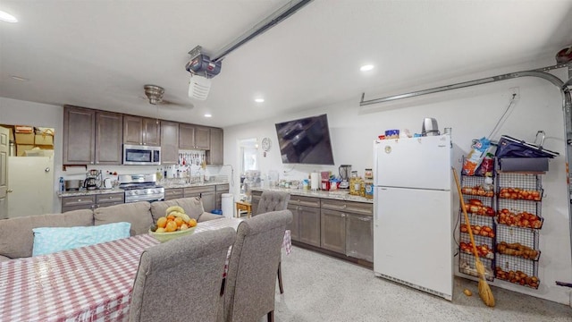 kitchen featuring dark brown cabinets, appliances with stainless steel finishes, and recessed lighting