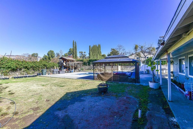 view of yard with a patio area, a fenced in pool, and a gazebo